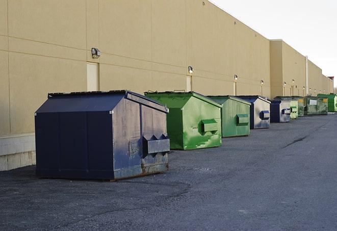 a row of industrial dumpsters for construction waste in Blue Rock